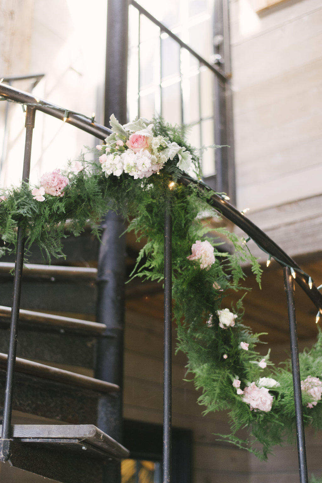 Mix up your greenery like we did here on this banister for a barn wedding in Westchester!