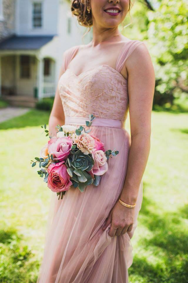 This romantic pale pink chiffon bridesmaid dress is perfect for an outdoor garden wedding. Get this look and more on our blog today!