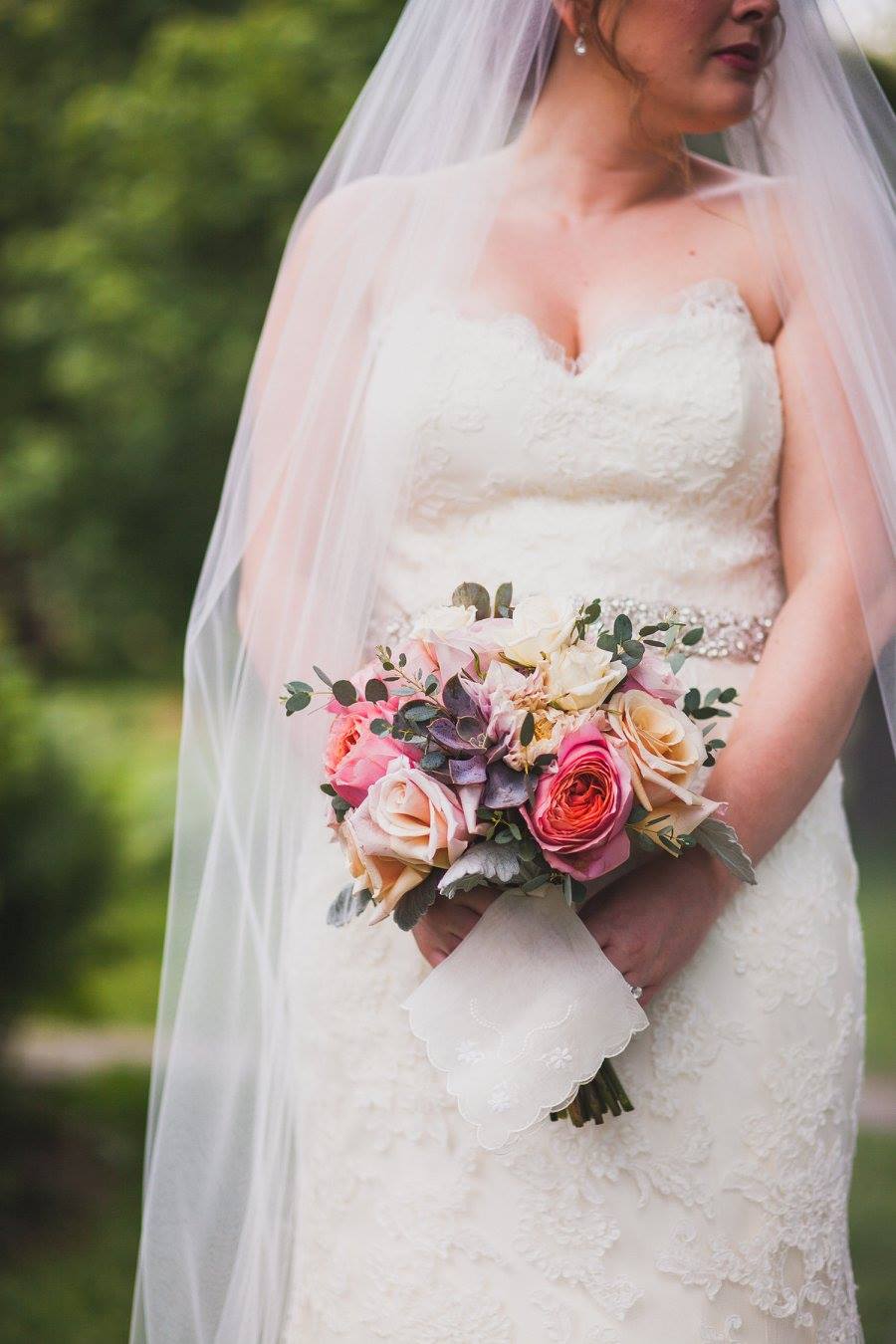 This fitted lace wedding gown that our bride wore for her rustic chic ceremony is perfect for a garden wedding too! Check out this gown and more inspiration for your garden wedding on the blog, and download the free printable wedding venue guide!!