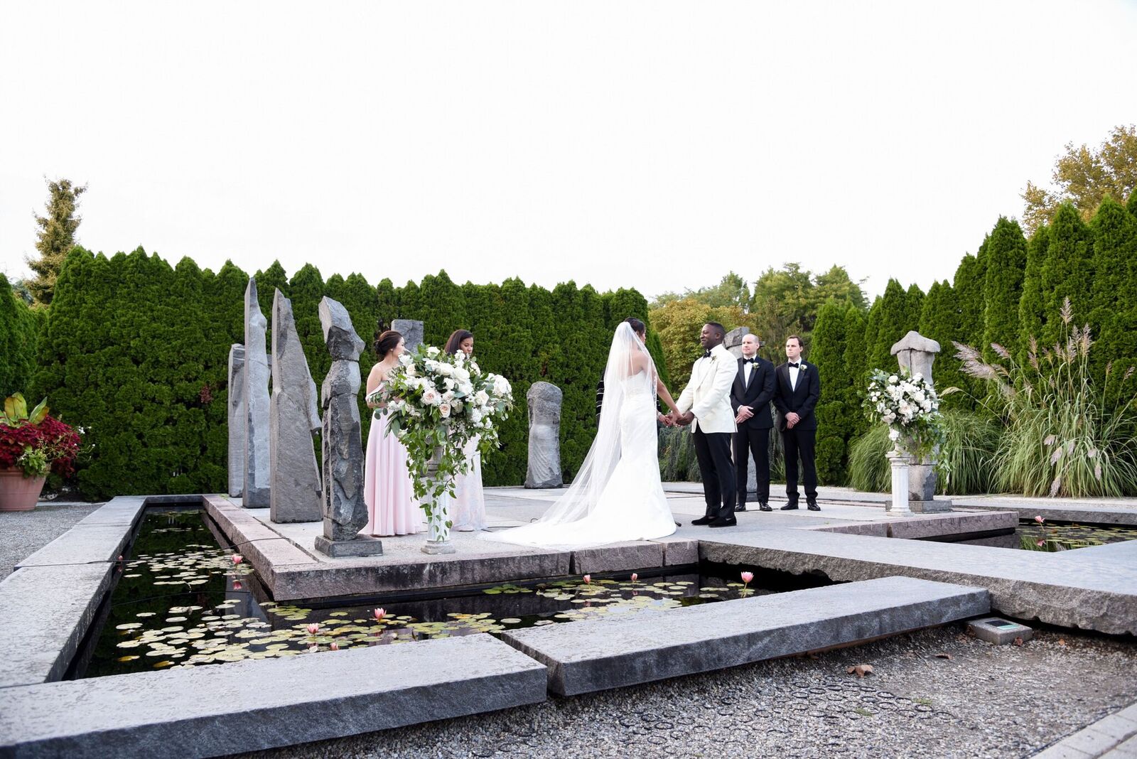 A traditional garden ceremony at Grounds for Sculpture complete with elegant and chic florals in white and green. Read more about this wedding on our blog!