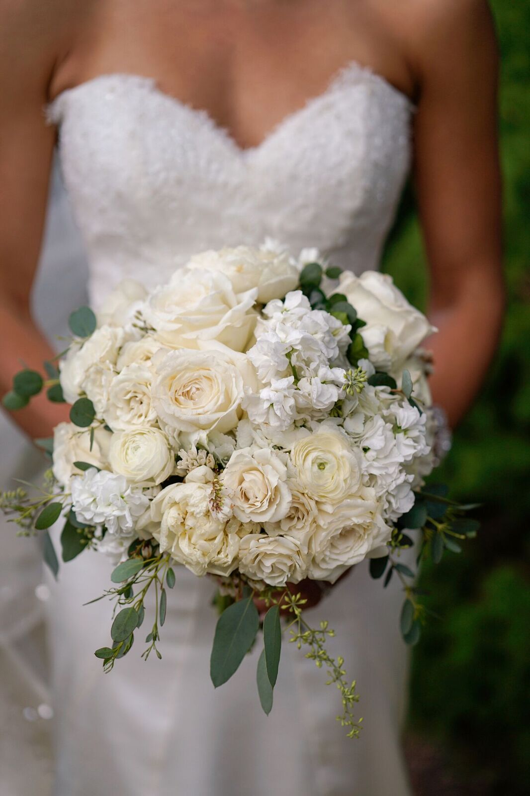 A gorgeous all white bridal bouquet was the perfect elegant touch for this upscale garden wedding we planned.