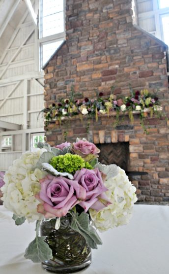 Wedding decor with a small arrangement and mantle design.