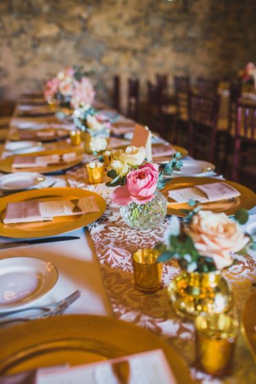 Pink, white and gold roses as wedding centerpieces