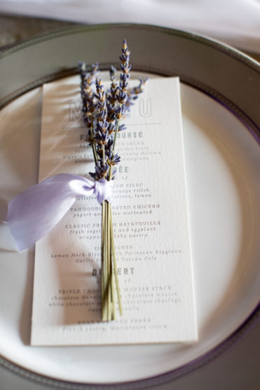 Lavender sprig at a wedding place setting