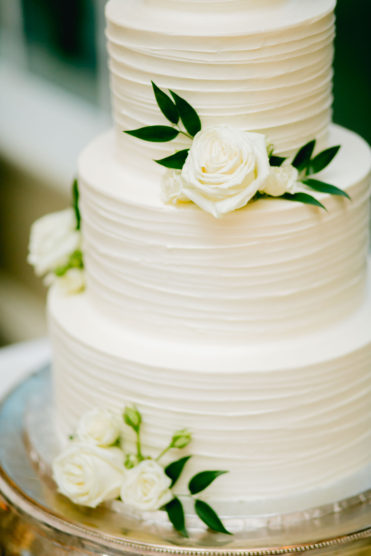 White wedding cake with real flowers