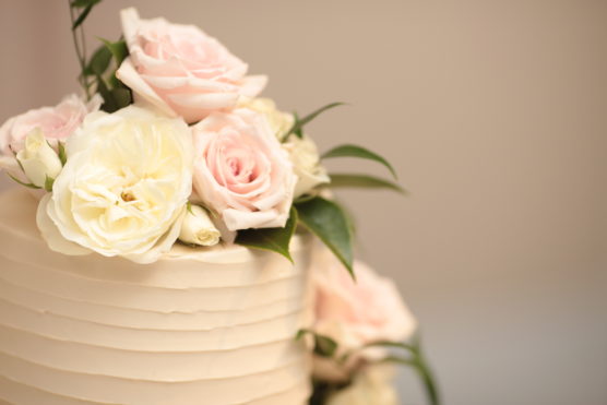 Roses on top of a wedding cake
