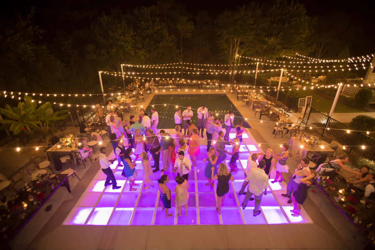 outdoor wedding with pool and dance floor