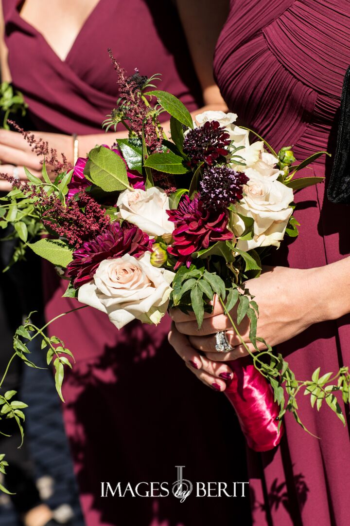 bridesmaids bouquets in deep colors