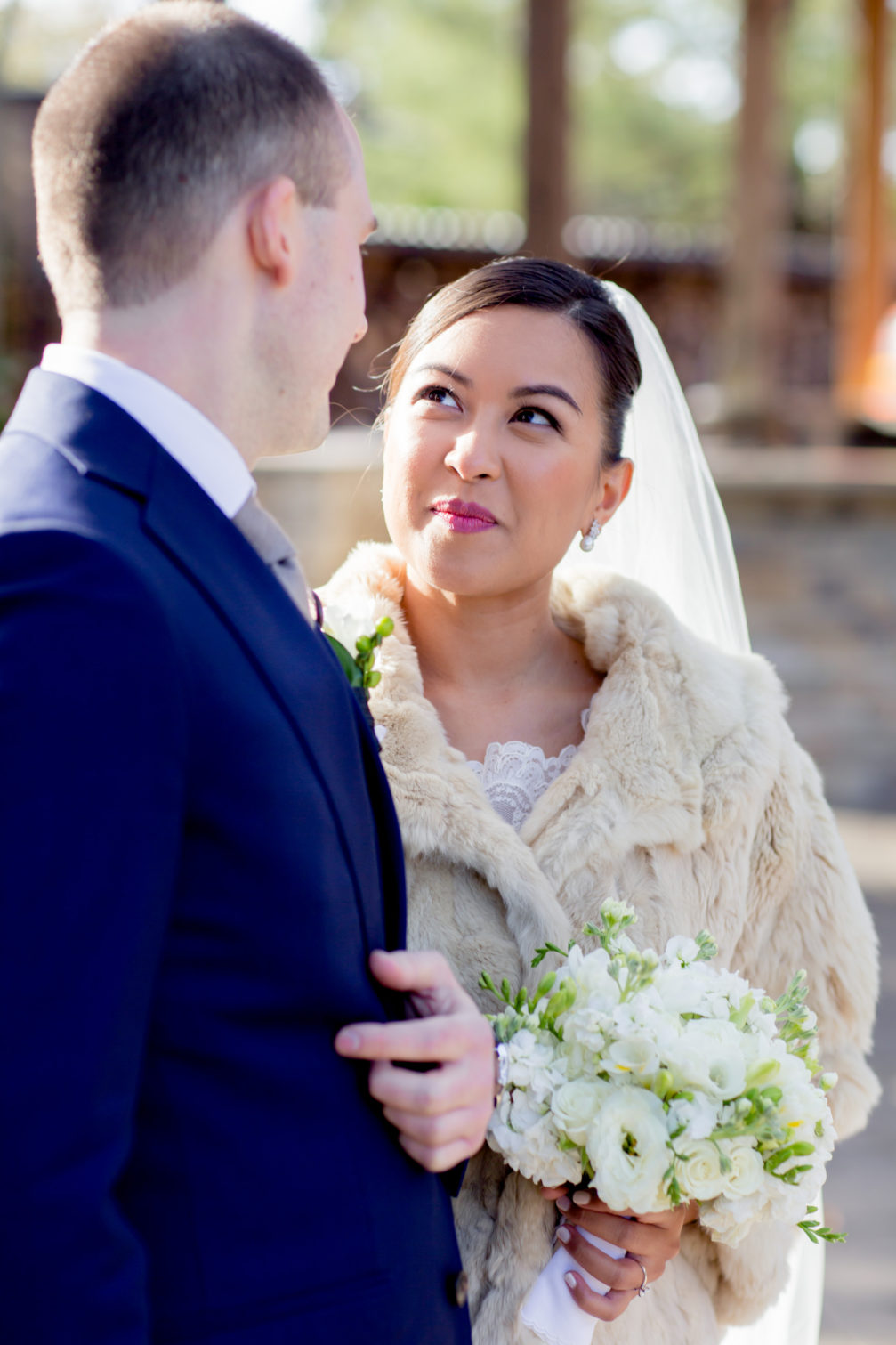 bride with fur stole over wedding gown