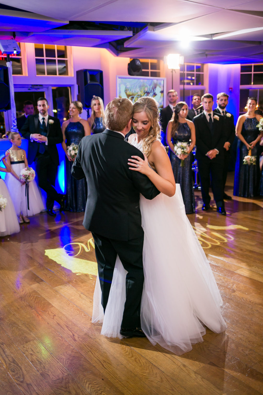 bride and father of the bride dancing at wedding reception