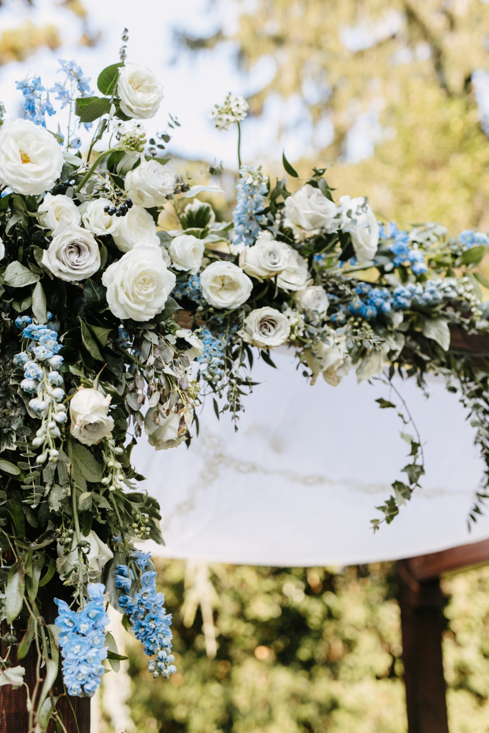 blue and white floral chuppah