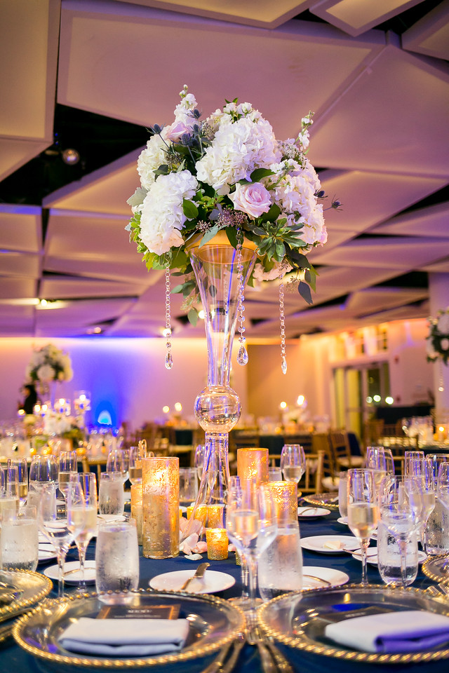 Tall white wedding centerpiece