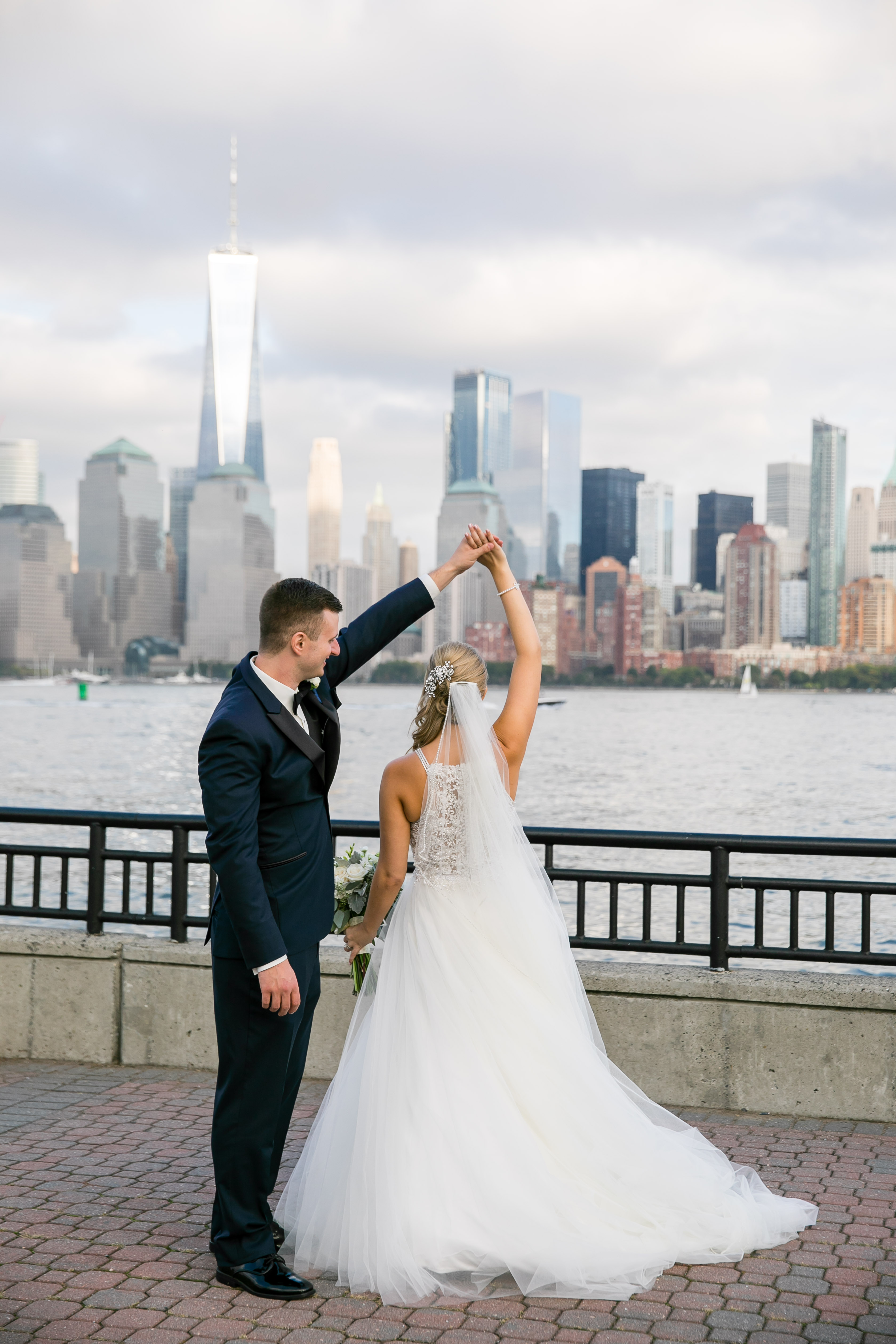 bride and groom twirling in nyc