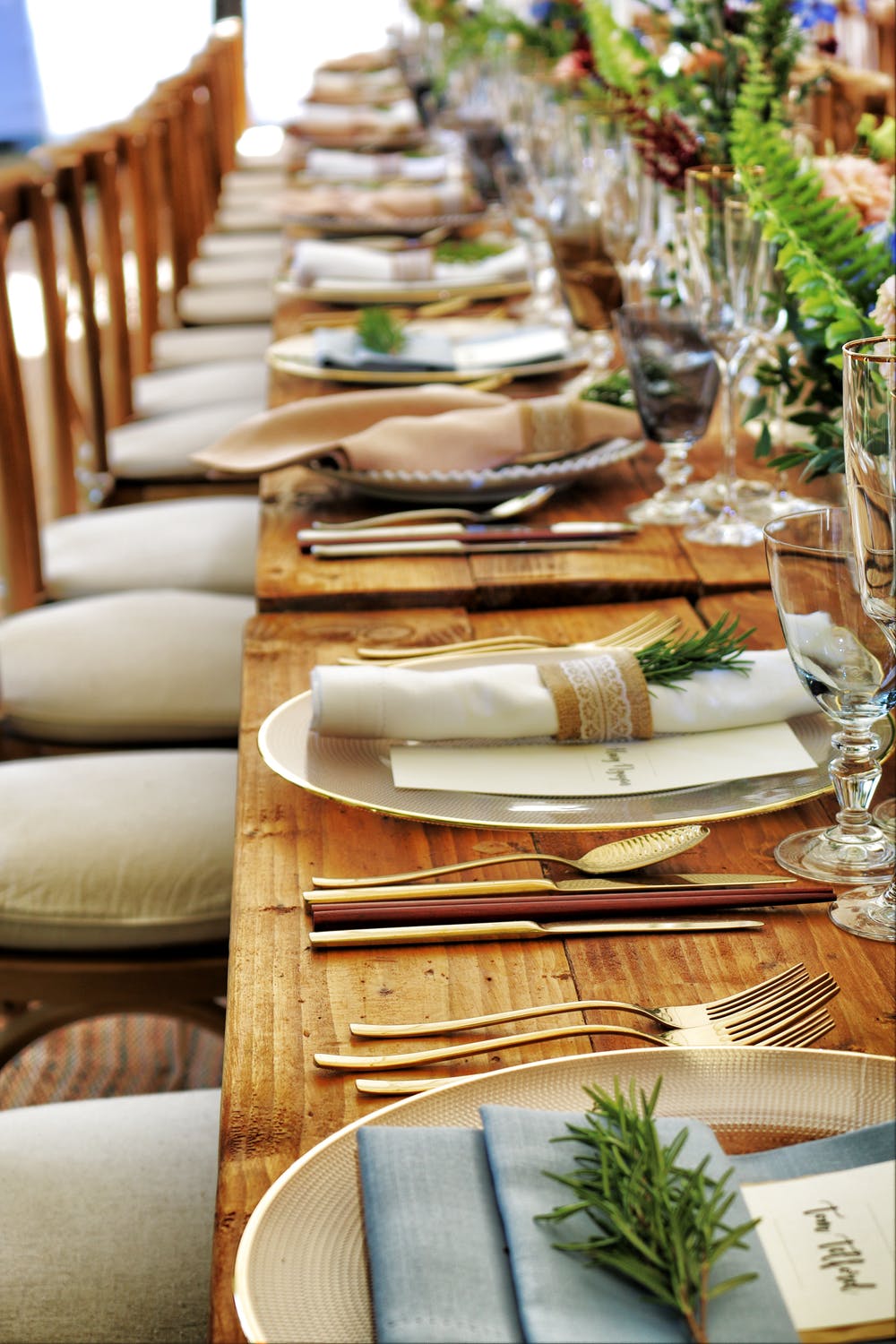 long wood table with evergreen touches