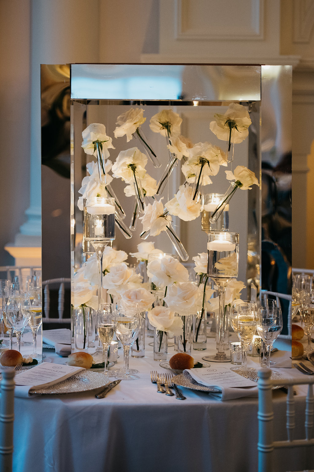 suspended white flowers in centerpiece at wedding