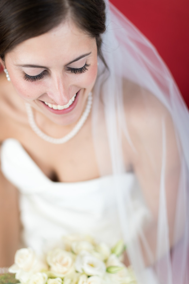 smiling bride in dress and veil