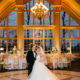 bride and groom inside reception ballroom