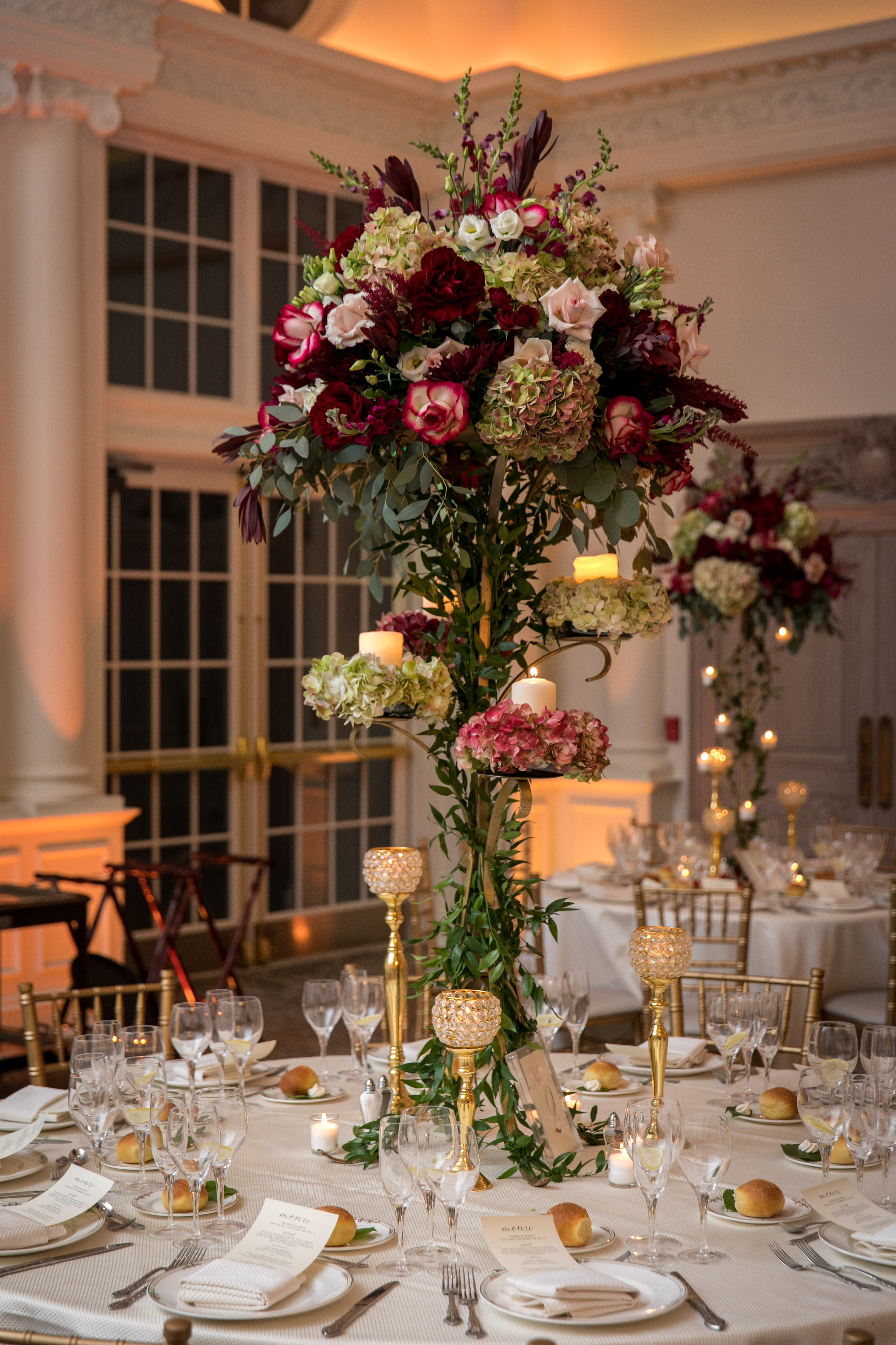 gorgeous tall centerpiece with red and green