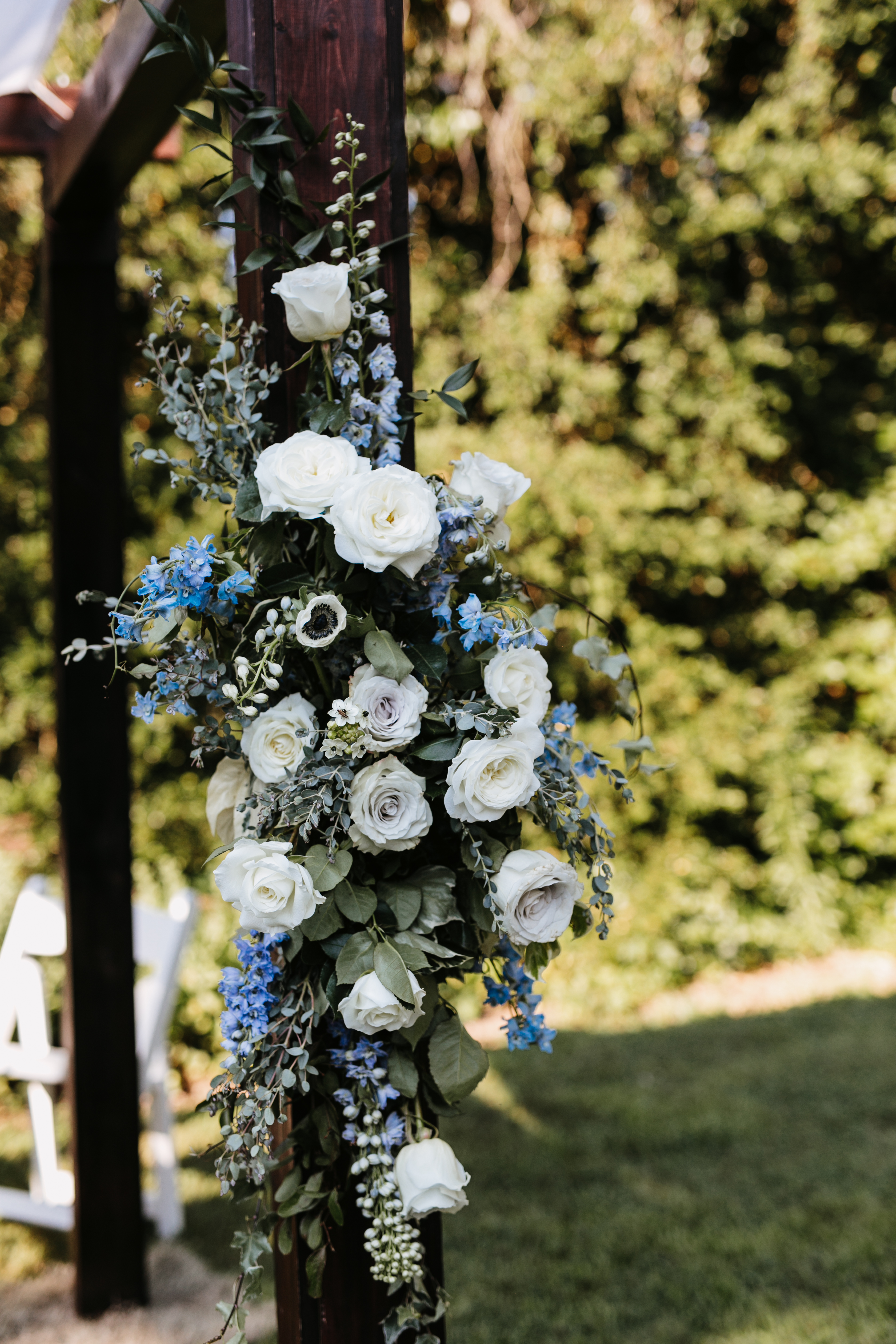 white blue and gray flowers on chuppah