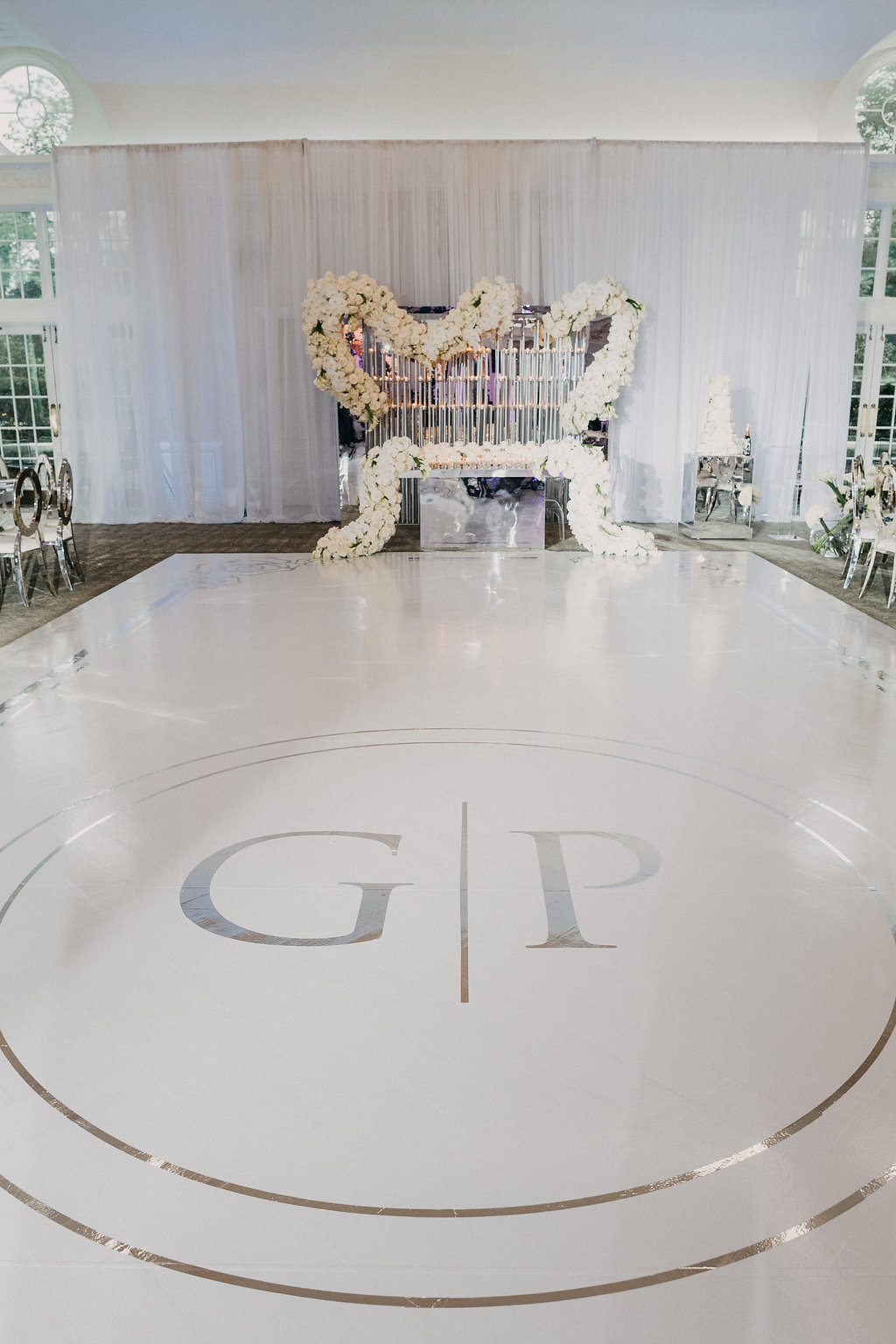 white dance floor with monogram