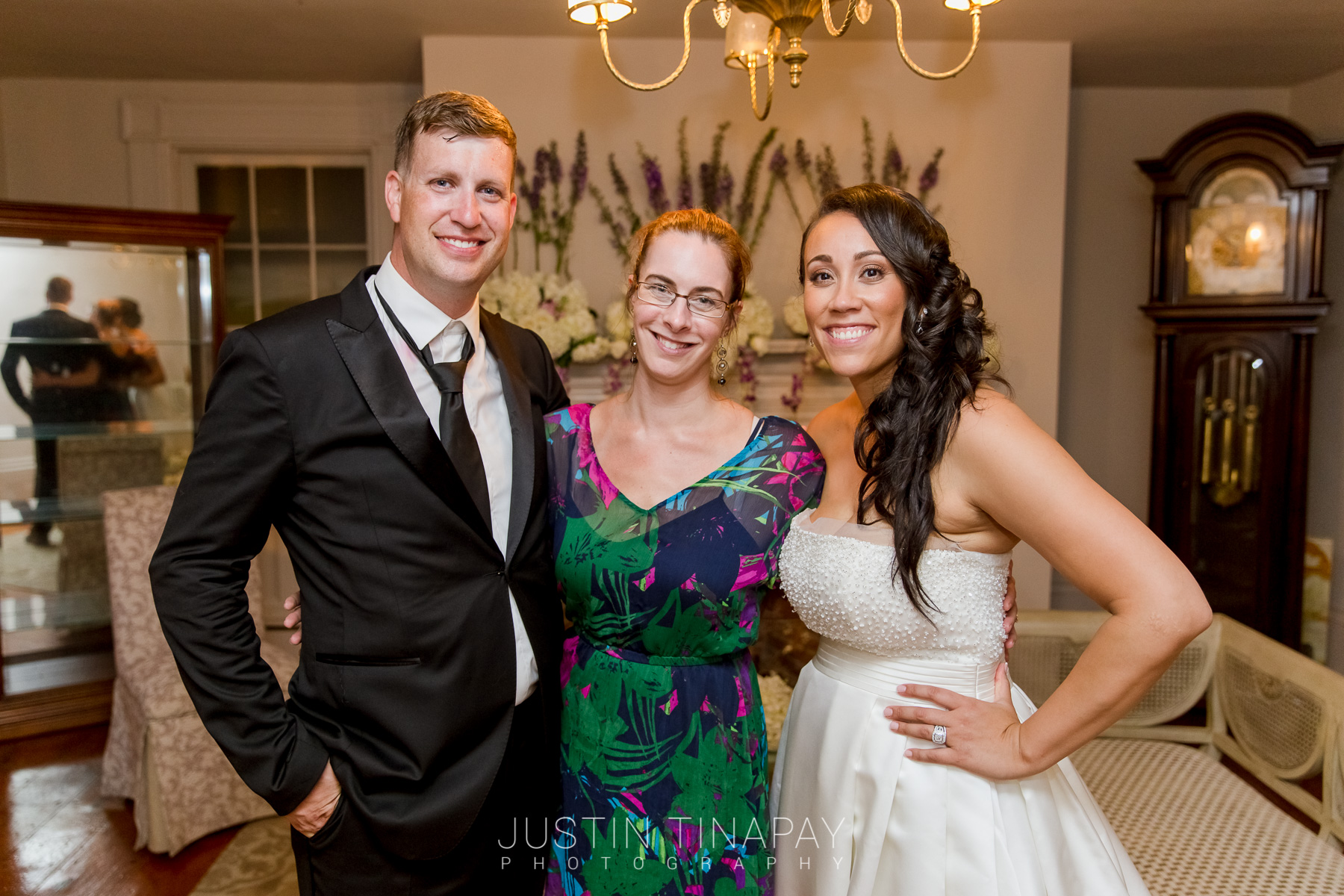 wedding planner posing with bride and groom