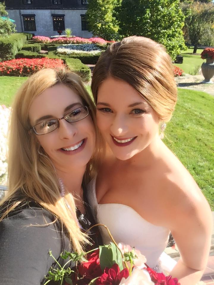 selfie of wedding planner and bride with bouquet