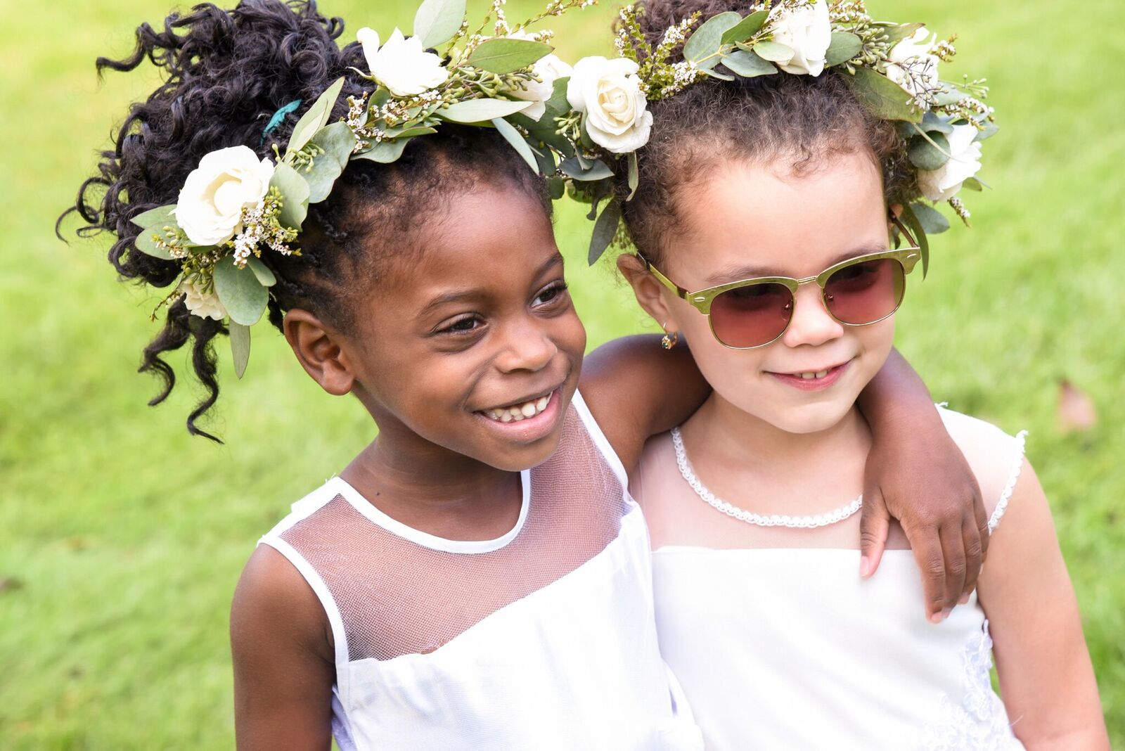 two flower girls with flower crowns