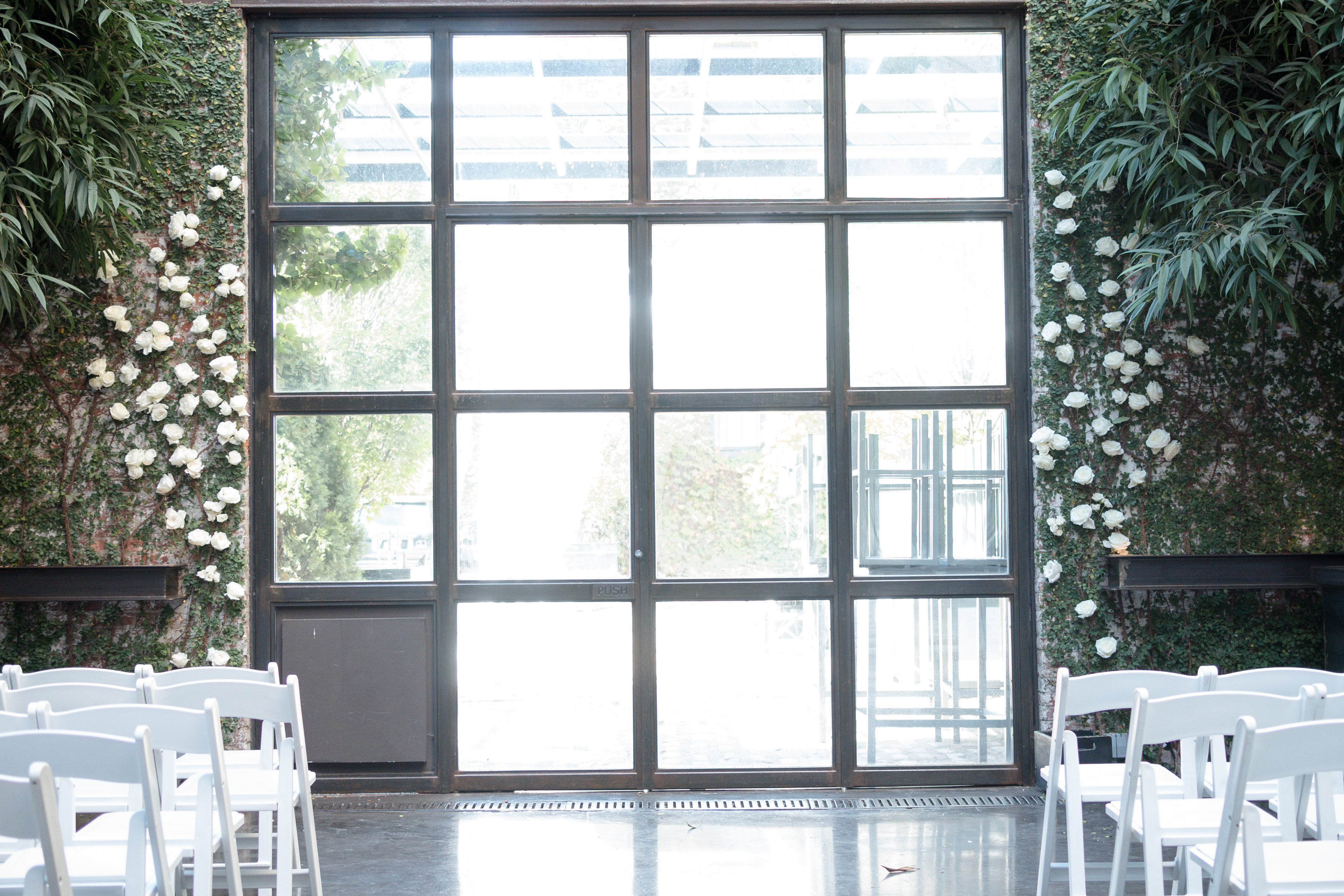 wedding ceremony site with green and white flowers