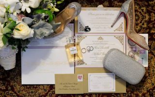 gold and white wedding invitations with red bottom shoes