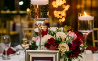 wine marsala reception table with candles