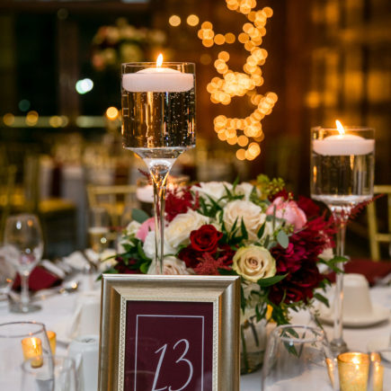 wine marsala reception table with candles