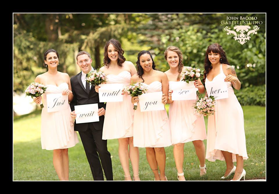 bridesmaids in short peach dresses