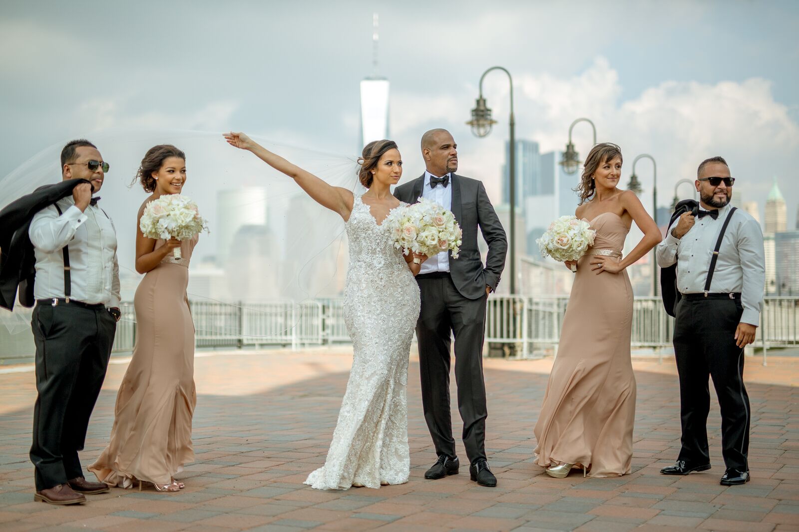 bride and groom with bridesmaids in champagne