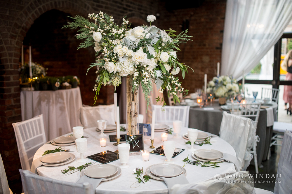 all white wedding reception with green and white centerpiece