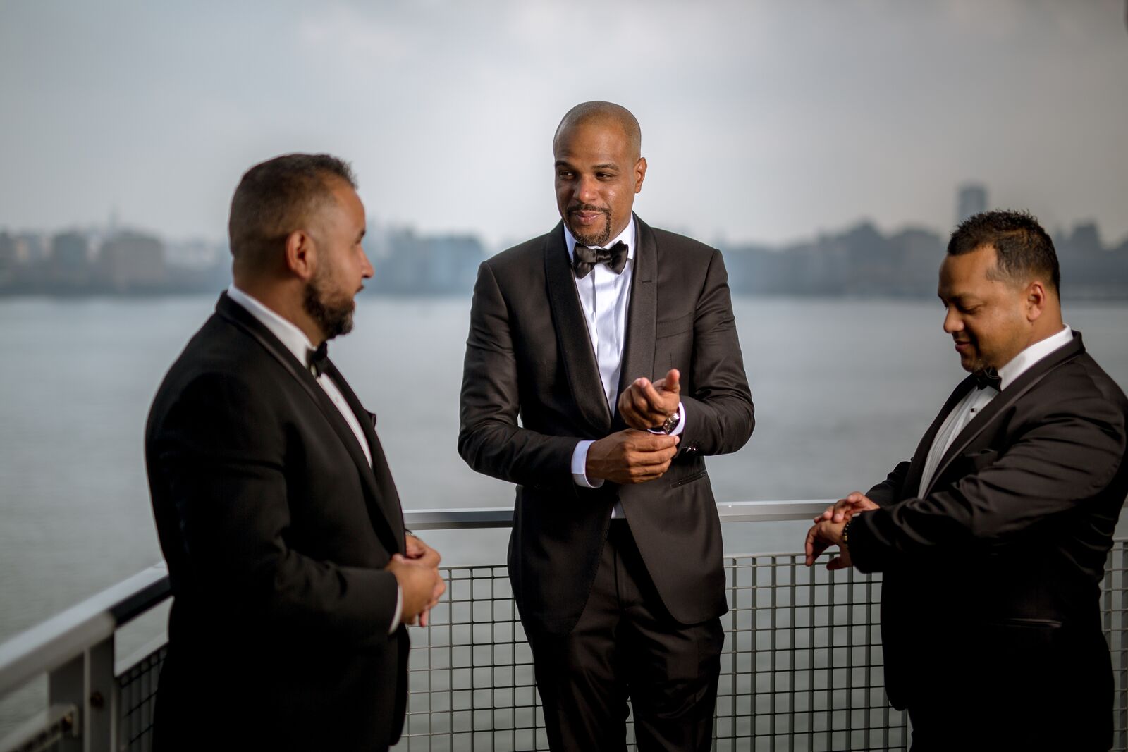groom and groomsmen in black tuxedos