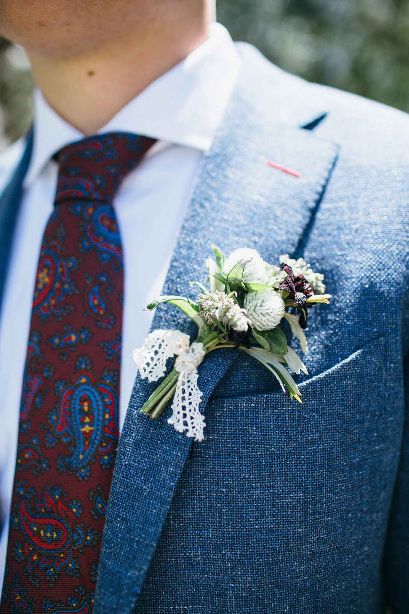 charcoal blue groom's suit with boutineer