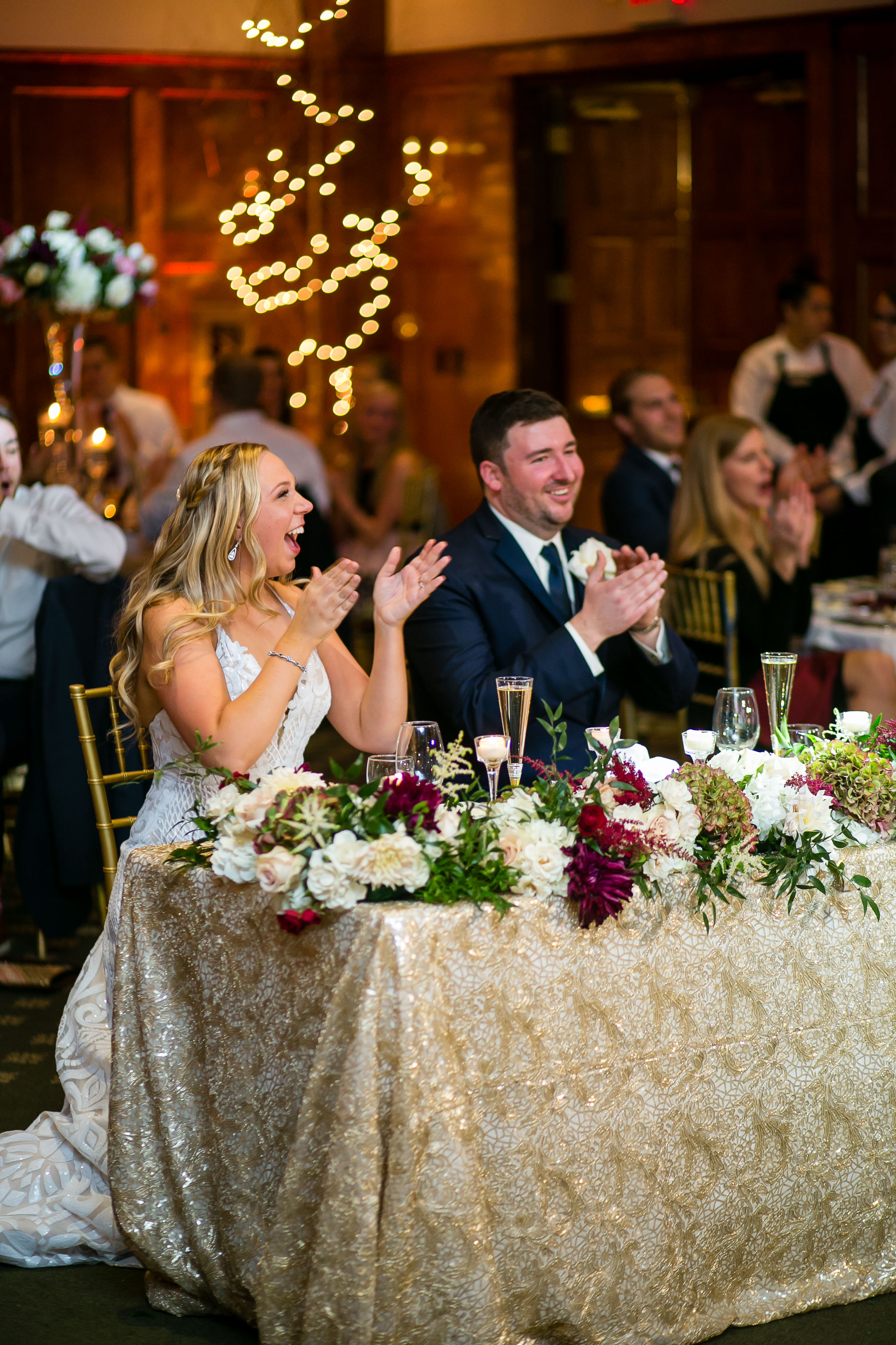 bride and groom at sweetheart table