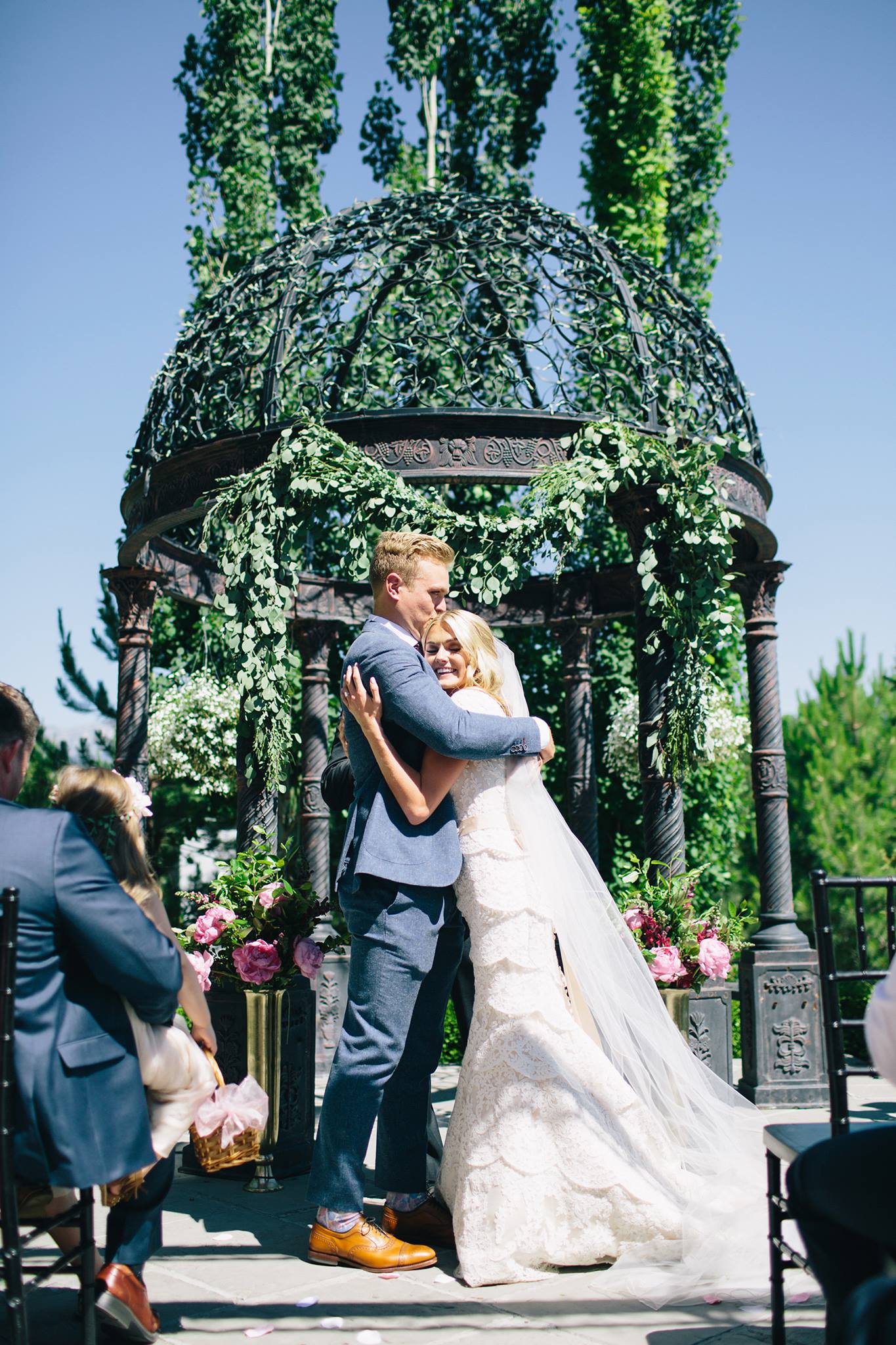 bride and groom embrace at ceremony