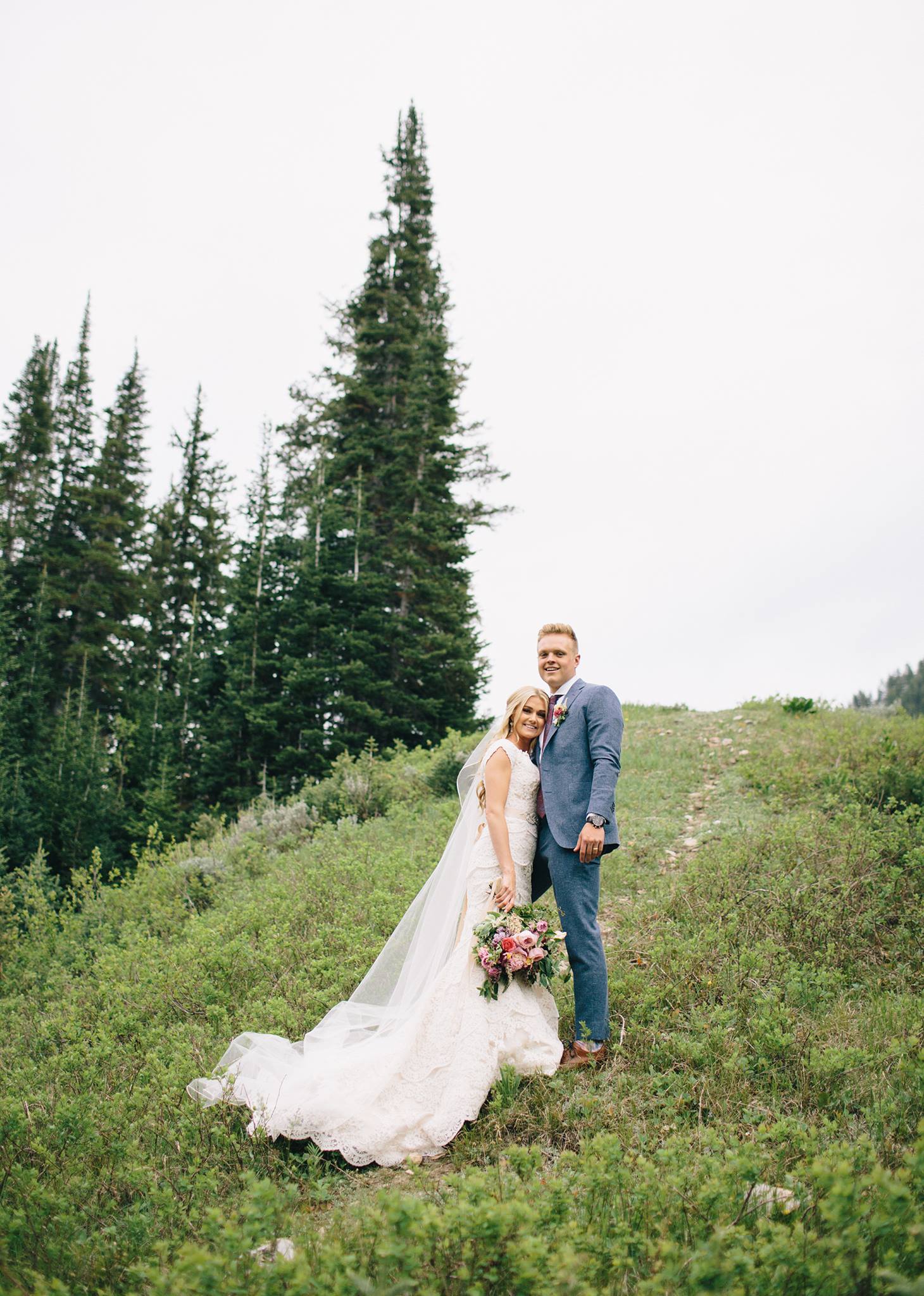 bride and groom on mountain