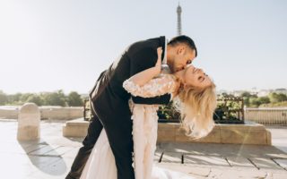 groom kissing bride in paris