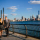 couple walking along NYC skylike