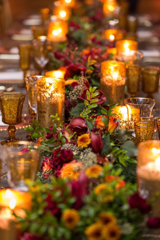 floral runner with candles down long table