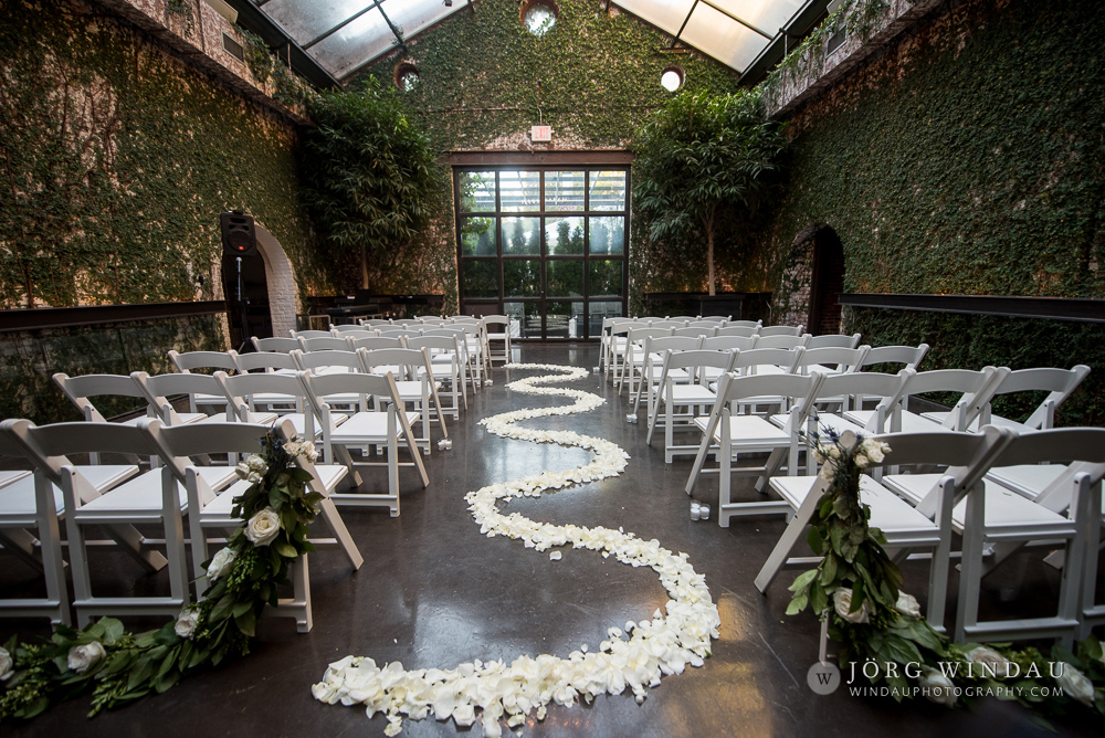 ceremony aisle with white rose petals