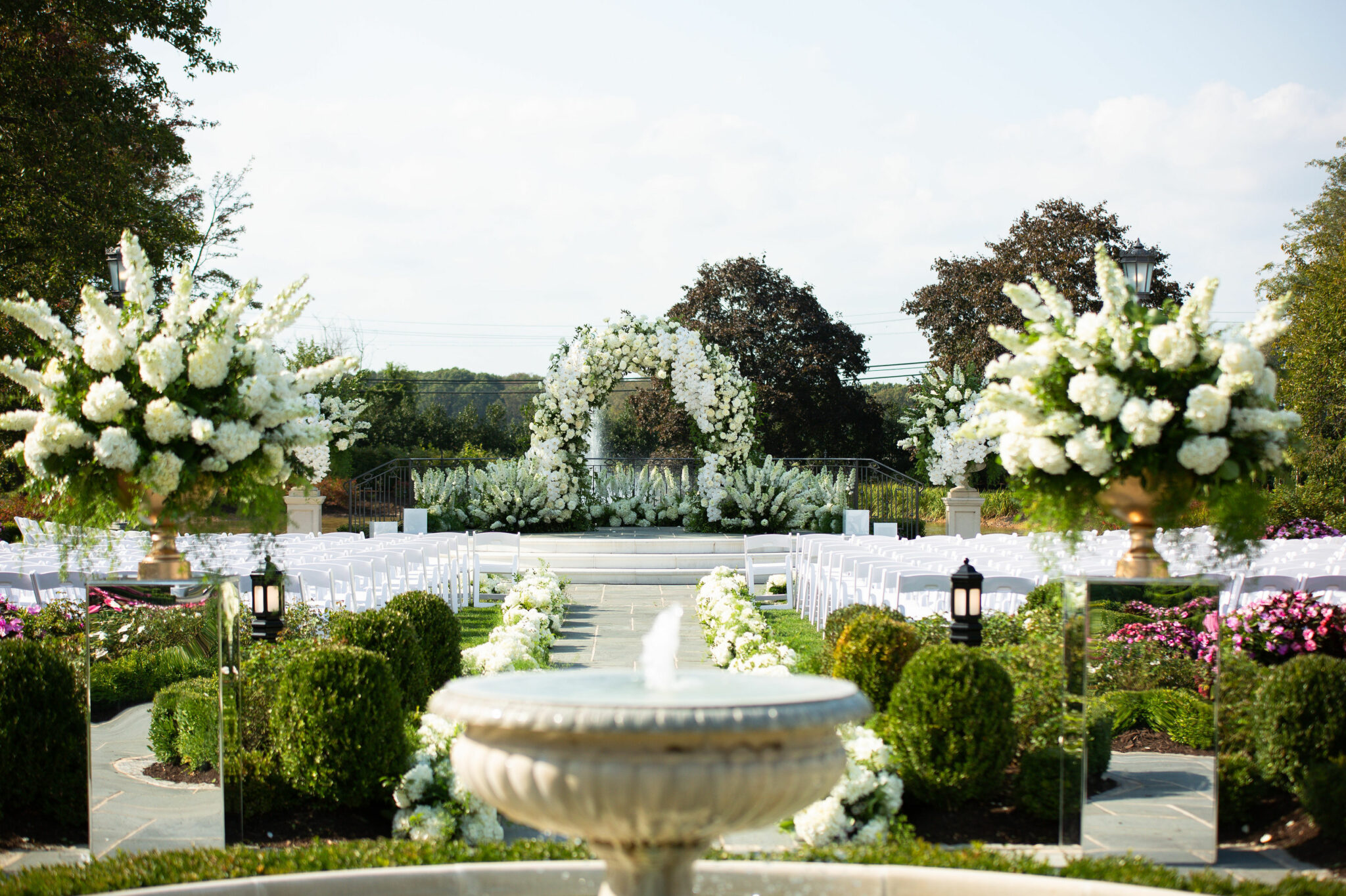 outdoor ceremony space with white and green flowers