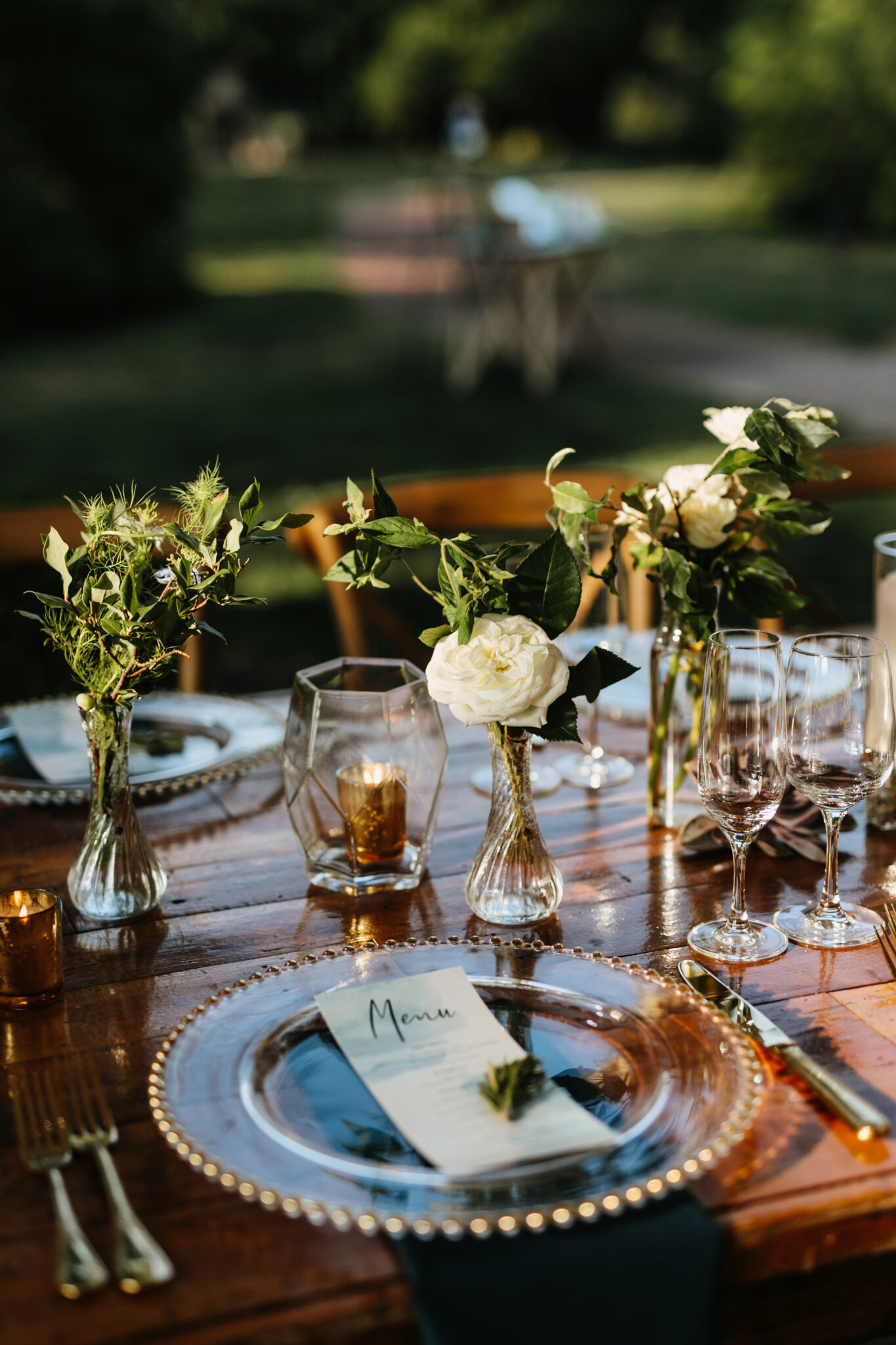 place setting at long table at farm wedding