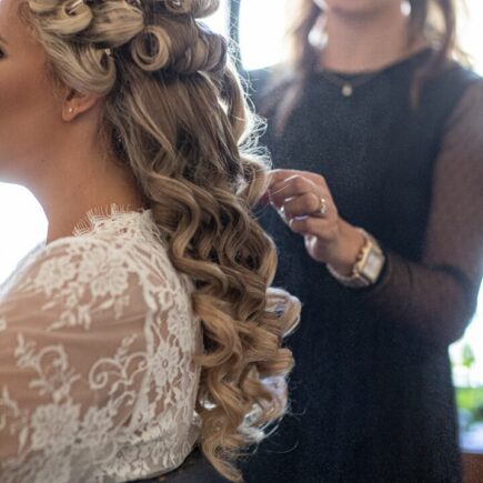bride getting hair done