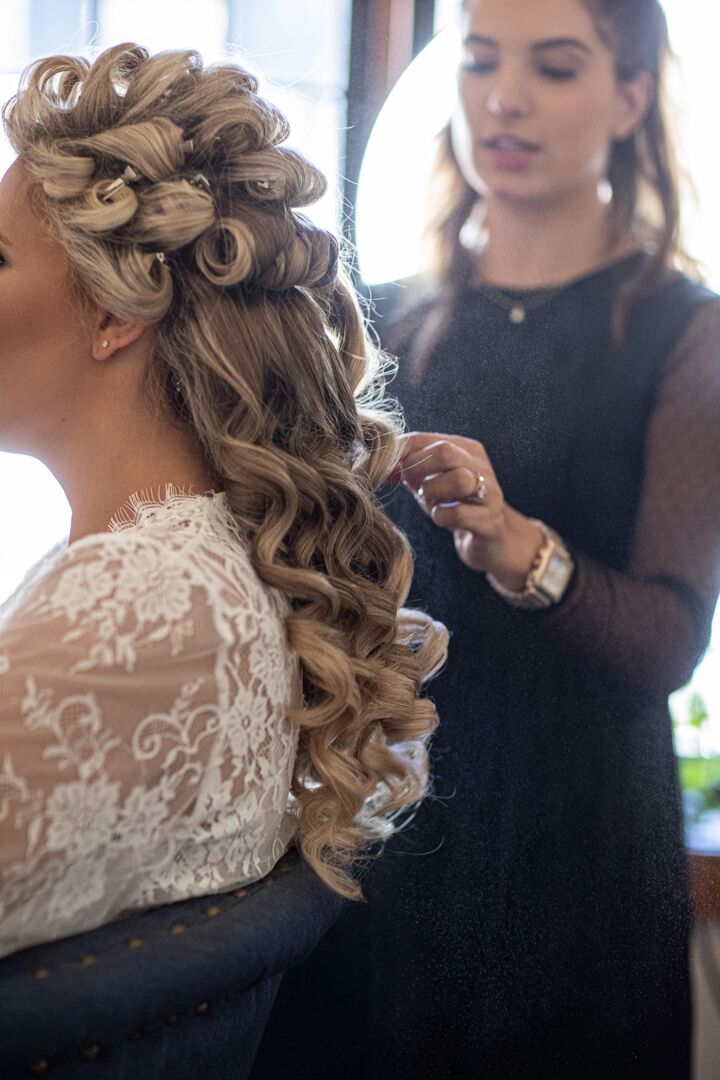 bride getting hair done