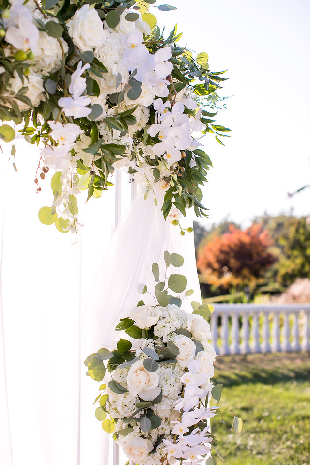 white and green flowers on chuppah