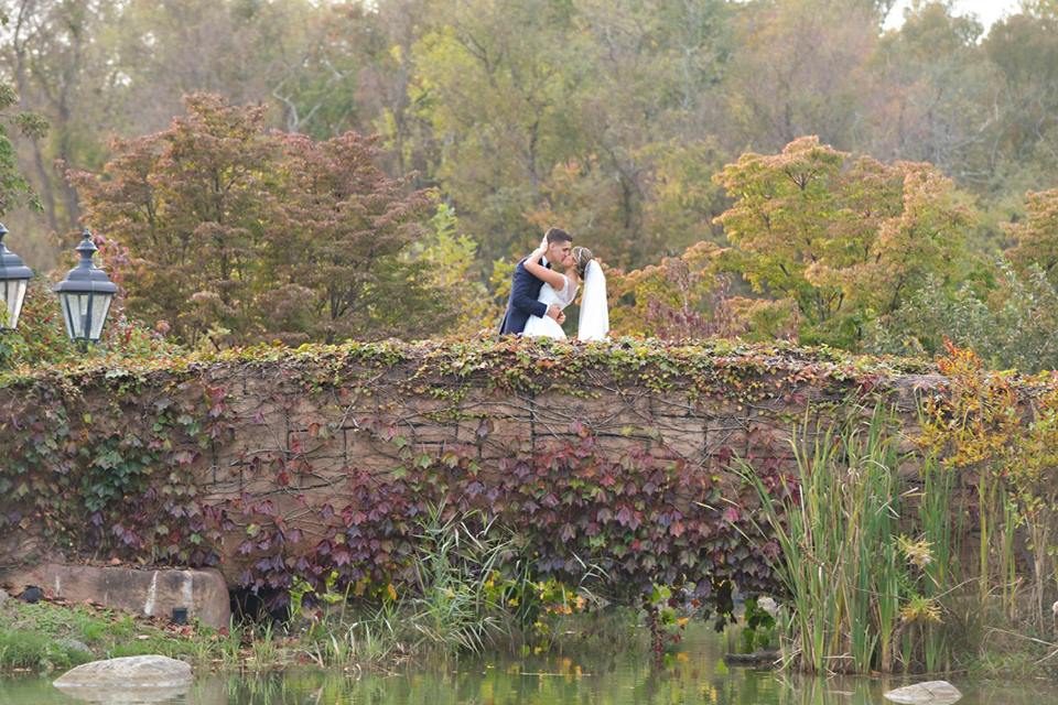 bride and groom on bridge