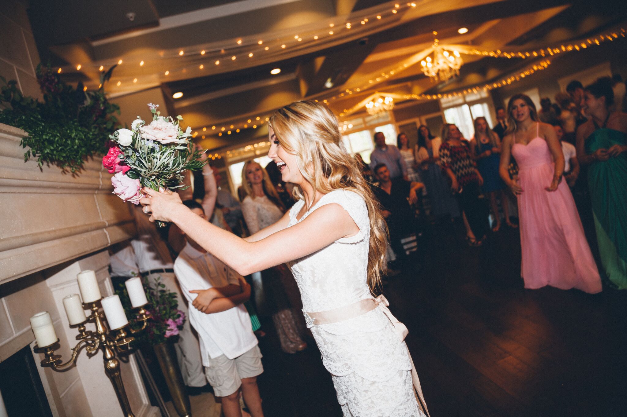 bride tossing bouquet